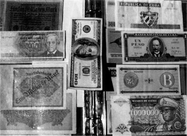 Paper currency marked from one million to 20 million German marks flanked by a - фото 129