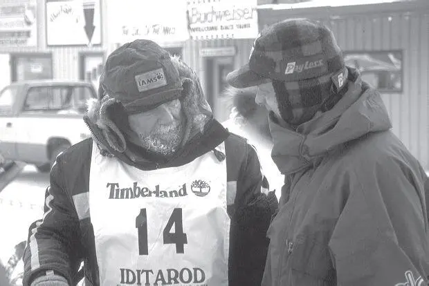 Martin Buser right winner of the 1994 Iditarod greets Ron Aldrich bib - фото 13