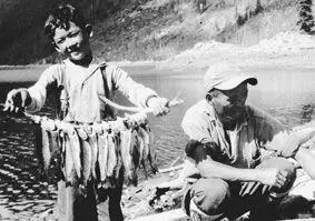 Displaying my catch with unidentified man at Beatrice Lake in what is now - фото 5