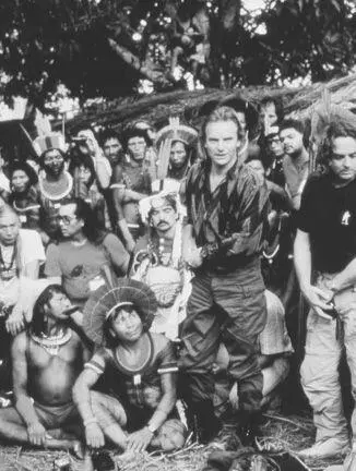 Press conference at Altamira Thats Sting standing Paiakan seated looking up - фото 32
