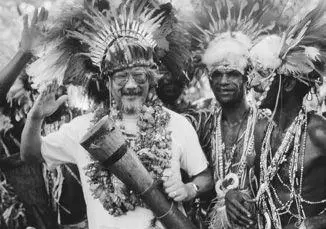 Trying out the drum given to me by people in the Kakoda Mountains in Papua New - фото 55