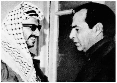 Then Chairman Yasar Arafat and Kamal Nasser are pictured here engaged in - фото 15