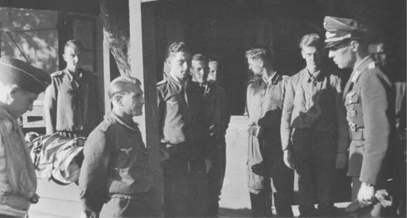 Hauptmann later Major GeorgPeter Eder second from left facing right and - фото 48