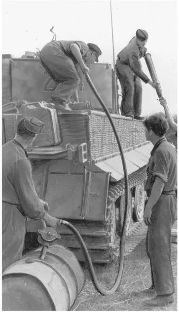 A tank crew refuel a Tigress from the 5th heavy tank battalion in Belorussia - фото 7