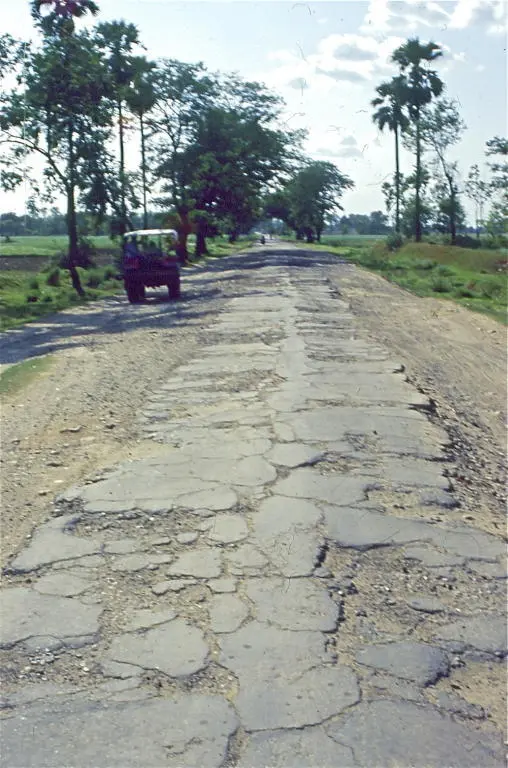 The bike shook and my teeth rattled as I slowed from a smooth 30 kilometres per - фото 6