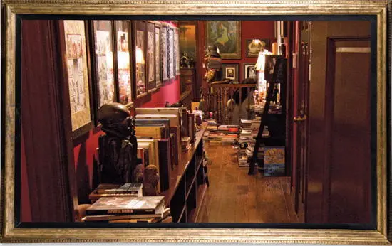The upstairs hallway at Bleak House cluttered with framed art books and - фото 23
