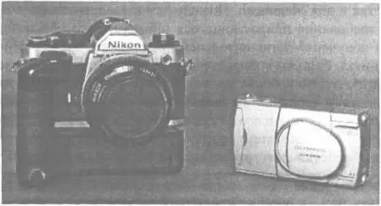 Ден нежно любит свой Nikon но может поместить свой цифровой фотоаппарат Olympus - фото 6