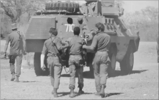 A captured FAPLA soldier is guided to an awaiting Ratel Photo courtesy Cameron - фото 61