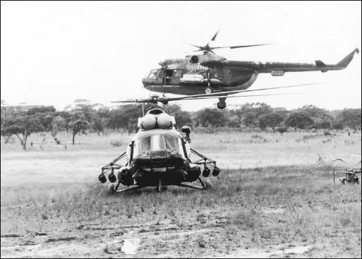FAPA Angolan Air Force Mi8 helicopters at Cuvelai southern Angola 1984 By - фото 86