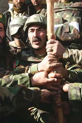 57 Brigadier Mohaydin right the Afghan army commander clutches a - фото 132