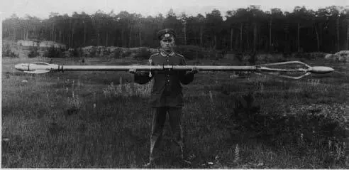 A soldier holds the rocket the Raketenflugplatz launched for the Army at the - фото 16