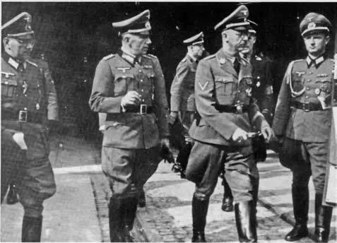 ReichsführerSS Heinrich Himmler center right began to take an interest in - фото 29