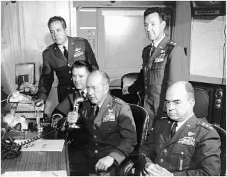 General Thomas Power surrounded by his staff in his command post at Offutt Air - фото 35
