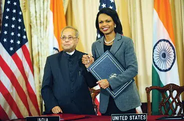 With Indian Foreign Minister Pranab Mukherjee on October 10 2008 signing the - фото 123