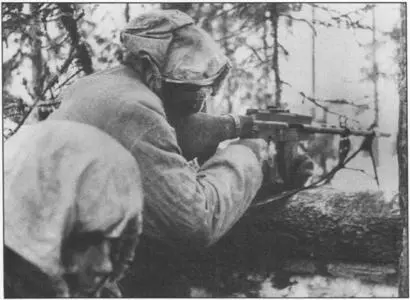 Gunner firing a Lahti automatic rifle at attacking Soviet infantry - фото 16