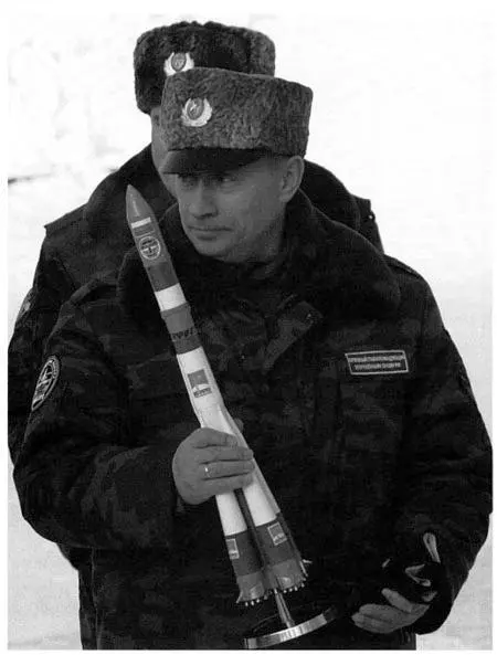 Not to be trifled with President Putin in uniform brandishing a model of the - фото 29