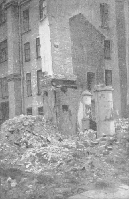 A VIEW IN PETERSBURG UNDER BOLSHEVIK RULE A wooden house has been demolished - фото 206