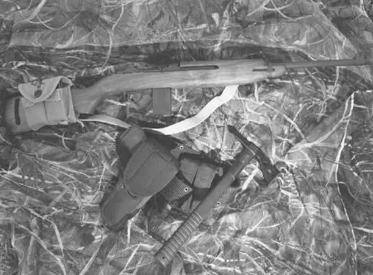 A fullstocked AutoOrdnance AOM130 reproduction M1 Carbine shown with a - фото 26
