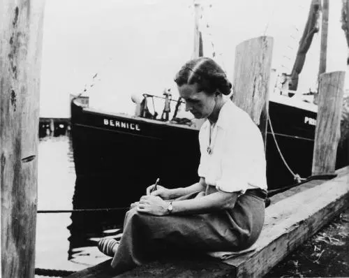 Carson writing on a dock She expressed her love for nature first as a writer - фото 10