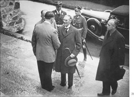 Britains Prime Minister Neville Chamberlain is greeted by Hitler on September - фото 34