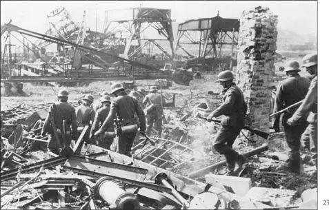 German troops search the rubble in Danzig after Hitler launched World War II by - фото 36