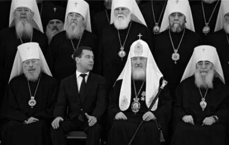 11 Russian Patriarch Kirill I centre right hailed the Putin era as a miracle - фото 14
