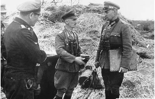 General Hasso von Manteuffel second from right discusses defense plans in - фото 76