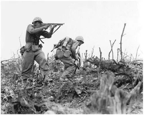 A Marine of the 1st Marine Division draws a bead on a Japanese sniper with his - фото 74
