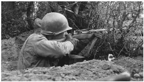 An American aims his Garand at a Nazi National Archives Private Joseph M - фото 81