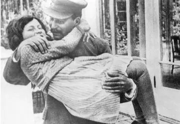 18 Stalin gives daughter Svetlana a cuddle 19 Stalins first son Yakob - фото 23