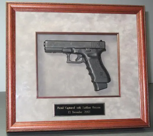 The pistol Saddam Hussein had with him when he was captured George W Bush - фото 258