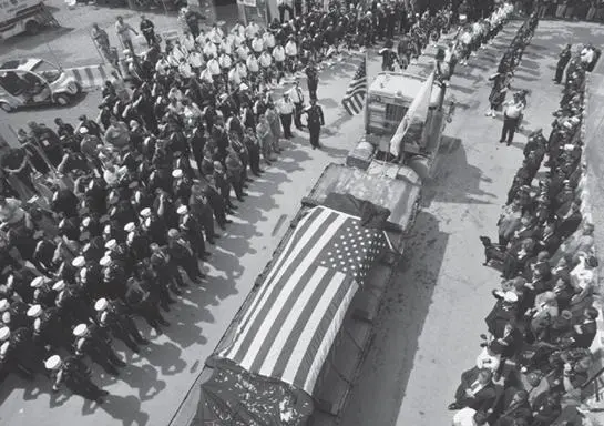 Nine months later draped in the flag the last steel girder is removed from - фото 35