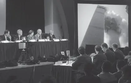 911 Commission members and staff watching video of the Twin Towers burning at - фото 50