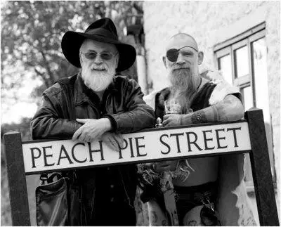 2 Terry Pratchett left and a character from his Discworld saga at one of - фото 9