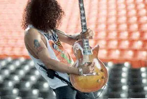 Slash doing a sound check during the Use Your Illusions tour Photograph by - фото 59