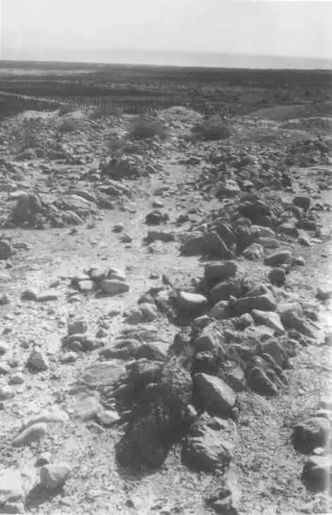 36 Several of the 1200 or so rockcovered graves slightly to the east of the - фото 37