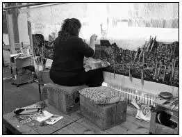 A modern tapestry weaver working on a tapestry She is able to finish around a - фото 15