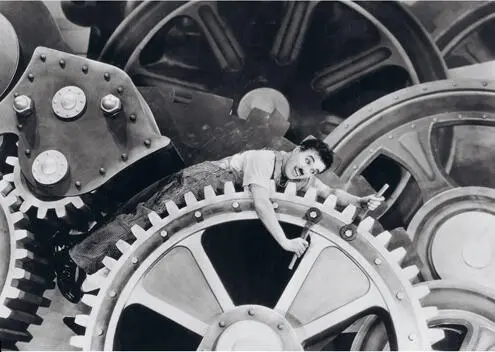 42 Charlie Chaplin as a simple worker caught in the wheels of the industrial - фото 63