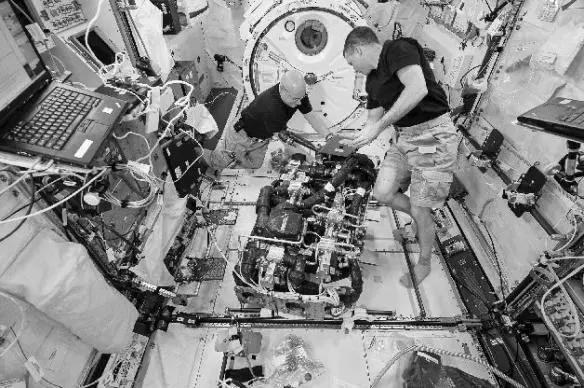 Terry Virts and me working on the Seedra in the Japanese module of the ISS - фото 15