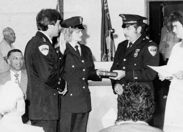 My father is holding the Bible as my mother is sworn in as the first female - фото 37