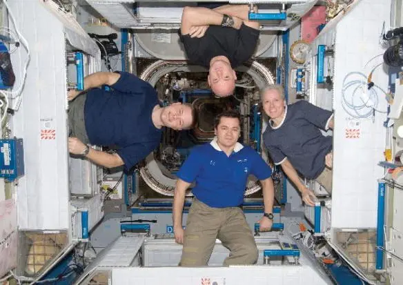 Hanging out of our crew quarters in Node 2 of the ISS From left Doug me on - фото 47