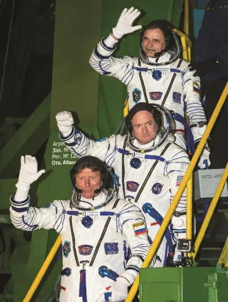We wave goodbye to friends and planet Earth as we board our Soyuz spacecraft - фото 60