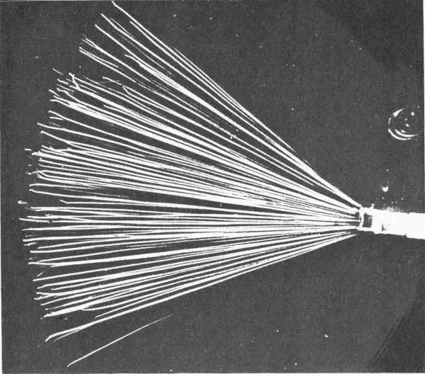 Alpha particles emitted by the source at right leave tracks in a cloud chamber - фото 14