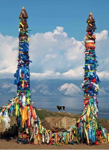 Olkhon Island in Lake Baikal Shamans have decorated wooden posts with colorful - фото 110