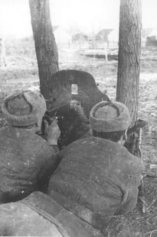 A Maxim machinegun crew opens fire on a village occupied by Germans The Maxim - фото 70