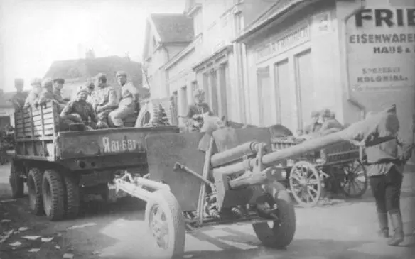A Soviet divisional ZIS3 76mm gun being towed by a Studebaker US6 truck drives - фото 71