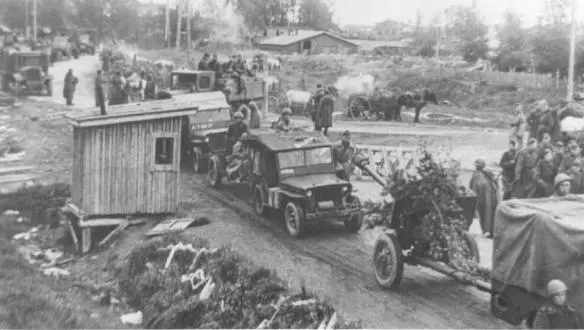 A sparsely camouflaged Soviet artillery column moves forward Dodge 34s pull - фото 80