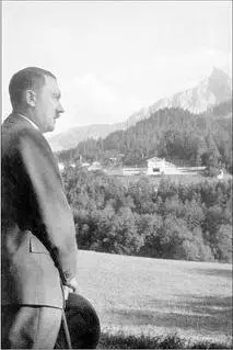 Hitler with the Berghof in the distance Hitler walking out of the Berghof with - фото 16