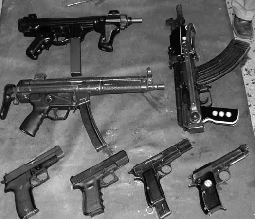 A selection of short weapons for car use brought in for sale from a - фото 9