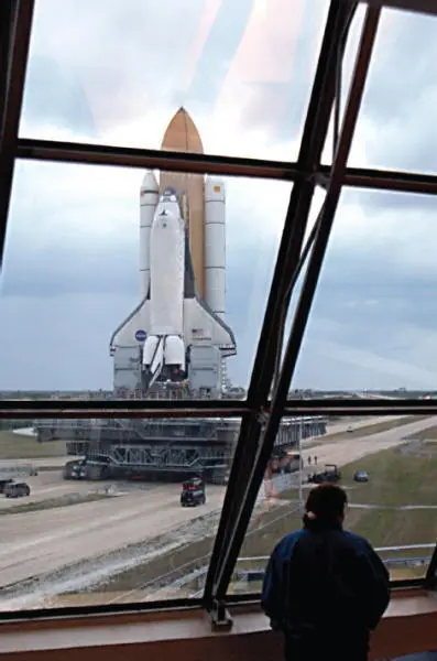 An observer in Firing Room 4 of the Launch Control Center watches Columbia roll - фото 30